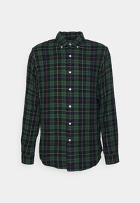 Green plaid button-up shirt with white buttons, featuring a collar, long sleeves, and a small logo on the chest. Textured cotton material.
