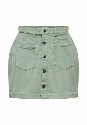 Jupe en velours côtelé vert clair avec fermeture à boutons à l'avant et deux grandes poches avant, dotée de passants pour ceinture à la taille.