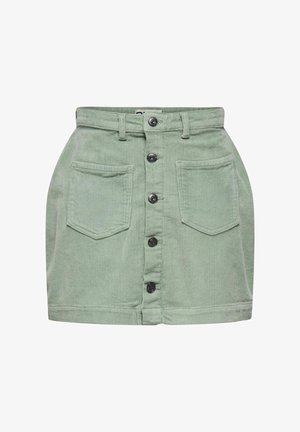 Jupe en velours côtelé vert clair avec fermeture à boutons à l'avant et deux grandes poches avant, dotée de passants pour ceinture à la taille.