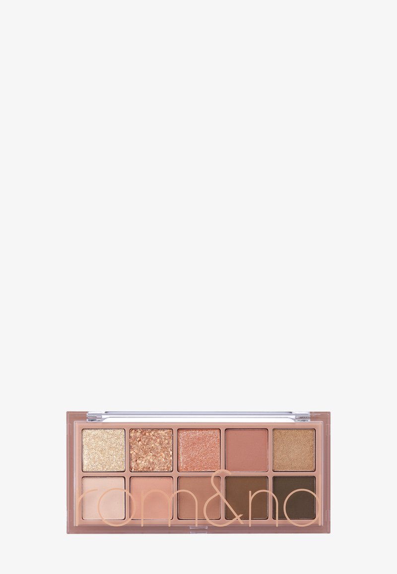 Palette de fards à paupières comprenant 10 carrés dans différentes nuances de beige, or et marron, avec 3 finitions pailletées et 7 textures mates. Étui transparent.
