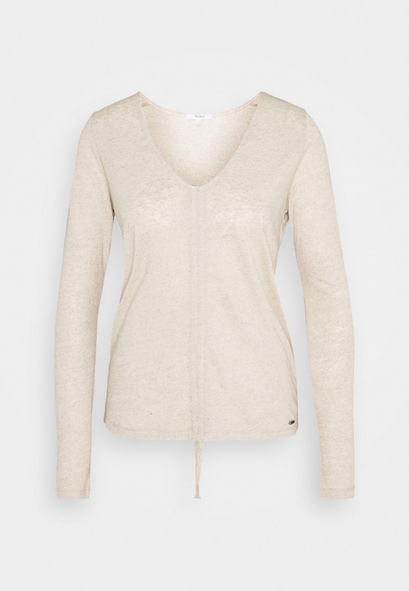 Haut à manches longues crème avec un col en V et un cordon de serrage à l'ourlet ; fabriqué en tissu doux et texturé ; design minimaliste sans motifs ni ornements.