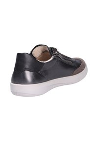 Low-top black leather sneaker with brown suede toe, side zipper, laces, and white rubber sole angled to show back and outer side.