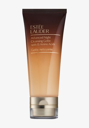 Estée Lauder Advanced Night Cleansing Gelée i en gradienttube som övergår från mörkbrun till ljusbärnsten, med guldaccent vid basen.