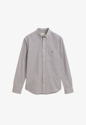 Chemise à manches longues à motifs carreaux bleus et blancs avec des accents rouges, présentant une poche poitrine et des détails au col. En coton.