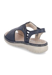 Navy leather sandal with cutout design, cushioned insole, light-colored rubber sole, and stitch detailing along the edge.