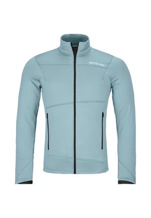 Light blue zip-up jacket with a high collar, made of soft fabric, featuring black zippers and seam accents, and two side pockets.