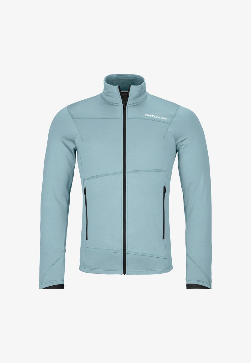 Helleblaue Zip-Jacke mit hohem Kragen, aus weichem Material, mit schwarzen Reißverschlüssen und Nahtakzenten sowie zwei Seitentaschen.