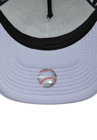 Light gray baseball cap with a black brim; features stitched lines and a circular sticker with a baseball design on the underside.
