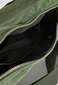 Next SLING - Torba preko tijela - khaki green