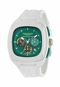 Montre avec un bracelet en caoutchouc blanc, un cadran carré vert, trois sous-cadrans en noir et bleu canard, et des accents argentés. Résistante aux chocs.
