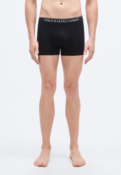Black boxer briefs with a fitted design, made of stretch fabric, featuring an elastic waistband with "POLO RALPH LAUREN" logo in white.