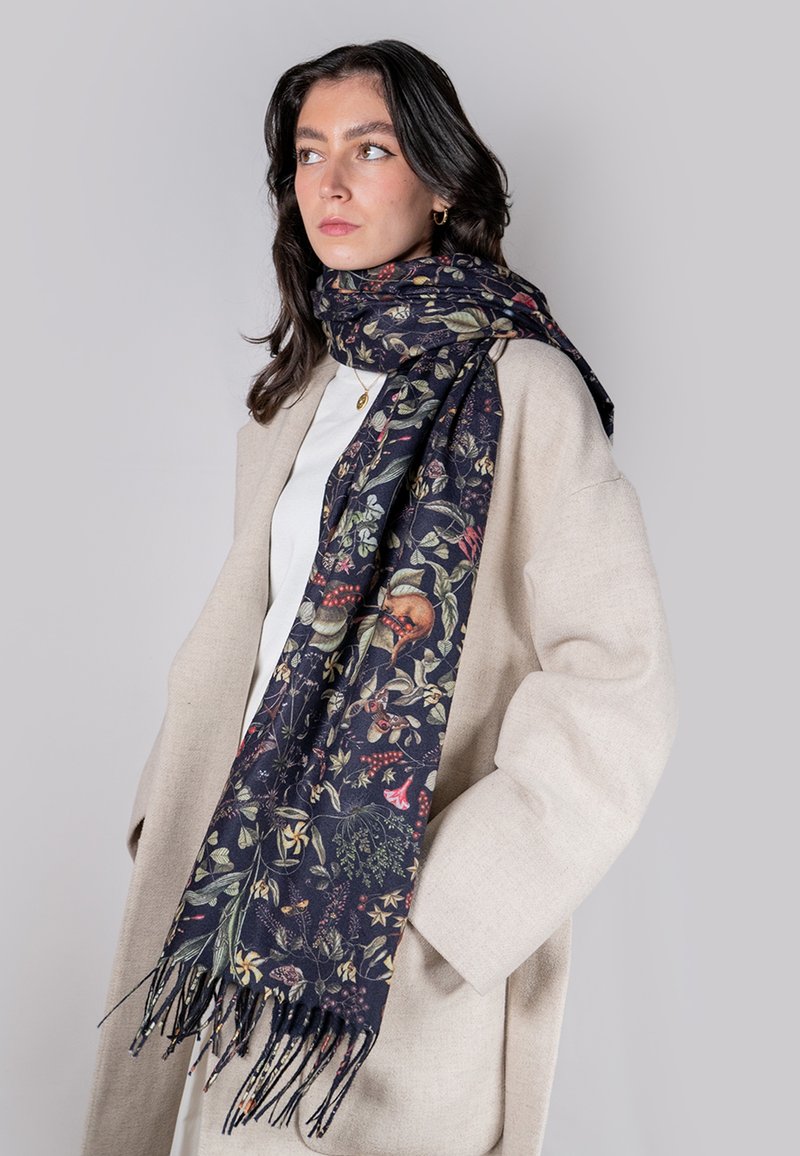 Dark floral scarf featuring intricate patterns in various colors, made from a soft material, with fringed edges and a rich texture.