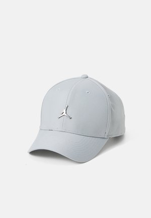 Light gray cap with a rounded crown, smooth texture, and a metal Jumpman logo on the front. Features a curved brim and stitched accents.