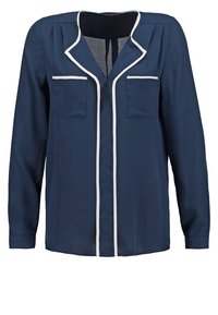 Marinblus med långa ärmar, vitt kantband längs kragen och knappraden, två bröstfickor och en slät, strukturerad tygliknande.