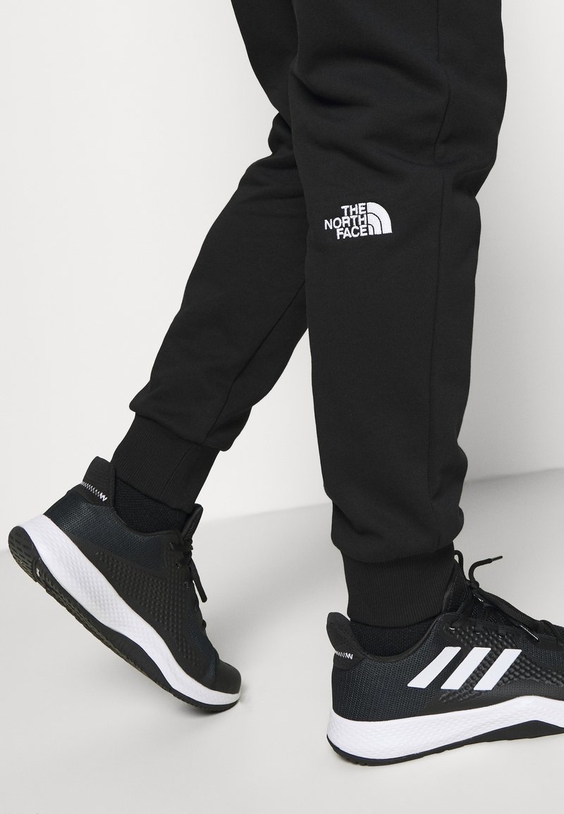 The North Face Pantalon de survêtement black/noir (Seconde