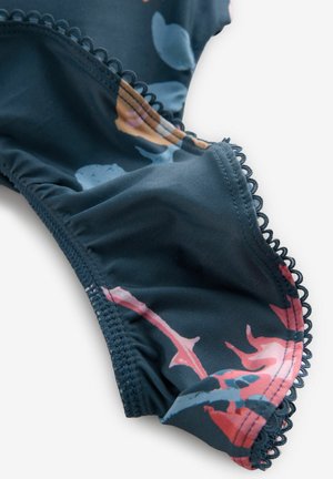 Floral-patterned swimsuit fabric in dark blue with pink and light blue accents. Features ruffled edges and picot trim for detail.