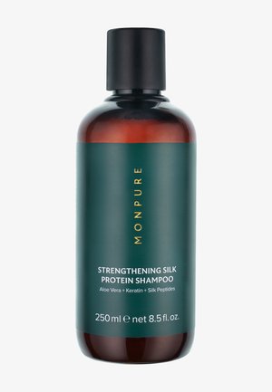 Ruskea pullo mustalla kannella, jossa etiketti Monpure Strengthening Silk Protein Shampoo, sisältäen aloe veraa, keratiinia ja silkkipeptidejä, 250 ml.