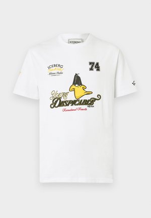 White cotton t-shirt featuring a yellow cartoon duck graphic, embroidered text "You're Despicable" and "74" with black accents and logo.