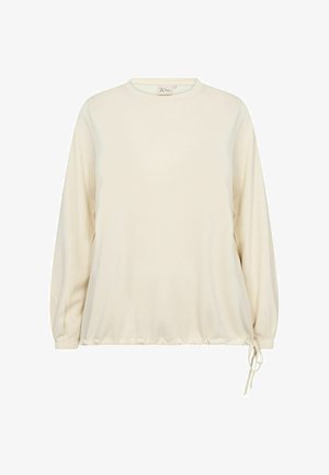 Krémové dlouhé tričko s kulatým výstřihem a nabíraným lemem. Obsahuje šňůrku na boku pro nastavení velikosti a texturovanou tkaninu.