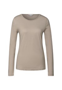Beige långärmad T-shirt gjord av mjuk, lätt bomull med rund halsringning och en slät textur. Enkelt utseende, utan mönster eller accenter.
