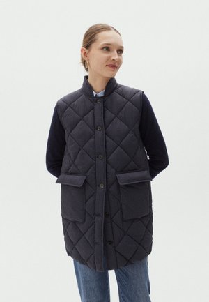 Gestepptes, ärmelloses Weste in Dunkelblau mit hohem Kragen. Verfügt über zwei Fronttaschen und runde Knöpfe, hergestellt aus strukturiertem Stoff.