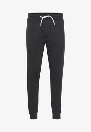 Dark gray sweatpants made of soft fabric, featuring a white drawstring, tapered ankles, and a simple design without pockets.