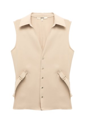 Beige sleeveless vest with a pointed collar, button front closure, and side straps with buckles. Smooth fabric with a minimalistic design.