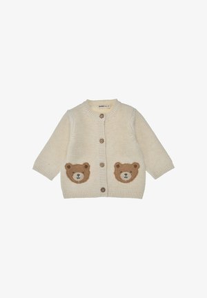 Cream-colored knitted baby cardigan with long sleeves, wooden buttons, and two brown bear face patches on front pockets.