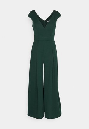 Dark green jumpsuit with a V-neck, cap sleeves, and wide-leg pants. Features a fitted waistband and smooth fabric texture.