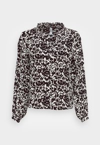 Blouse à manches longues avec motif floral noir et blanc, dotée d'un col à volants et de poignets élastiques, confectionnée dans un tissu léger.