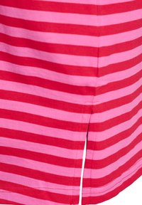 Close-up of pink and red horizontal striped fabric with a stitched seam and a small side slit.