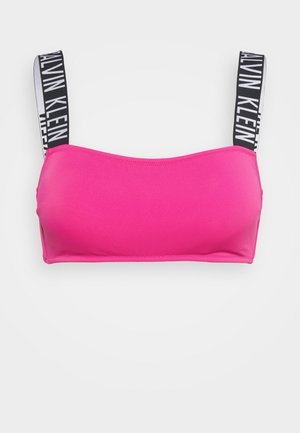 Top bandeau rosa con spalline brandizzate nere e bianche. Materiale liscio con un design semplice e senza cuciture. Senza ferretto né imbottitura.