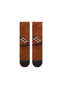 Rudi, minkšti audiniai kojinės su Chewbacca dizainu, turinčios tekstūruotą paviršių, baltus ir juodus akcentus bei tamsiai rudus rankogalius.