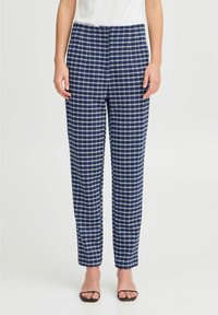 Pantalons à carreaux navy avec une coupe droite, fabriqués à partir d'un tissu lisse. Comprend une taille et des poches passepoilées sur les côtés.