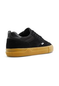 Black sneakers featuring a mix of suede and mesh materials, a round toe, and a gum rubber outsole. "Element" logo on the heel.