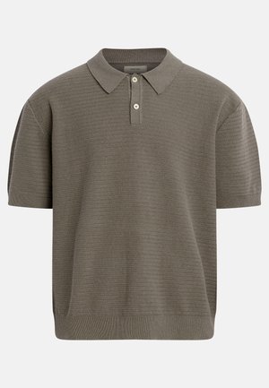 Short-sleeve knit polo shirt in olive green with textured horizontal ribbing, two-button placket, and classic collar.