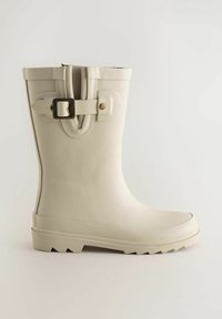 Stivale da pioggia bianco in gomma con punta arrotondata, suola testurizzata e cinturino regolabile sulla gamba. Finitura liscia con design minimalista.