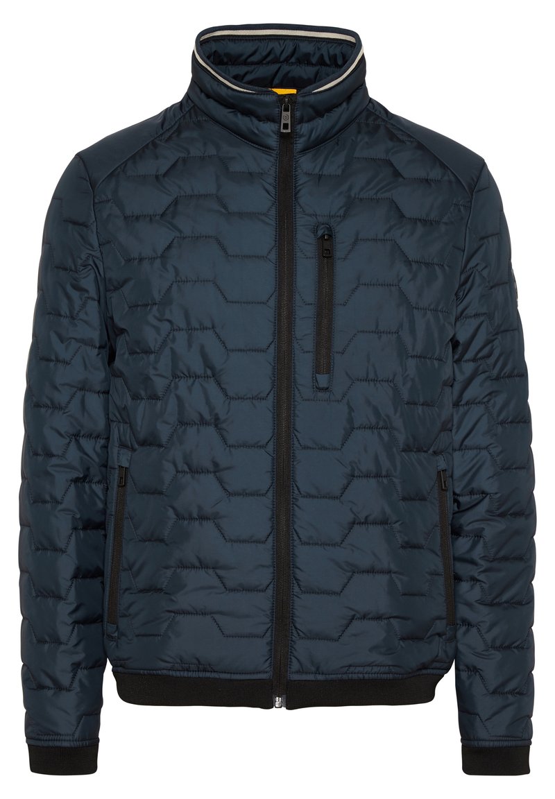Veste matelassée marine avec col montant, fermeture éclair sur le devant et poches latérales. Présente une texture hexagonale et des poignets et un ourlet côtelés noirs.