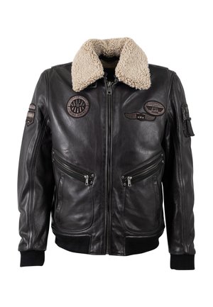 Giubbotto bomber in pelle nera con colletto foderato in pile, tasche con zip e vari ricami sulla parte anteriore e sulle maniche.