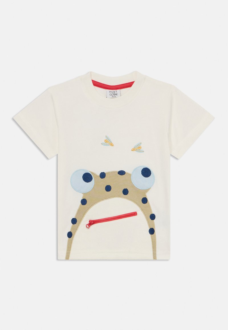 Weißes Baumwoll-T-Shirt mit einem gestickten Froschdesign, großen blauen Augen, schwarzen Punkten und einer roten Reißverschlusstasche.