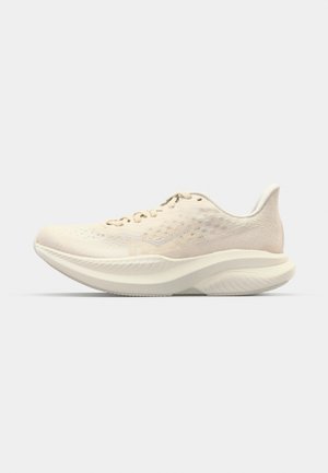 Light beige running shoe with a textured upper, cushioned sole, and round toe. Features a tonal logo and laces throughout the vamp.