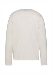 Lange mouw shirt in licht beige, met een eenvoudige ronde hals en een zachte katoenen textuur. Geen zichtbare patronen of hardware-details.