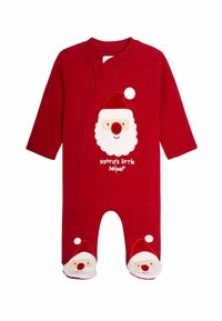 Mono de algodón rojo con la cara de Papá Noel, que tiene una barba blanca, nariz roja y gorro. Texto "El pequeño ayudante de Papá Noel" abajo. Bonitos detalles en los pies.