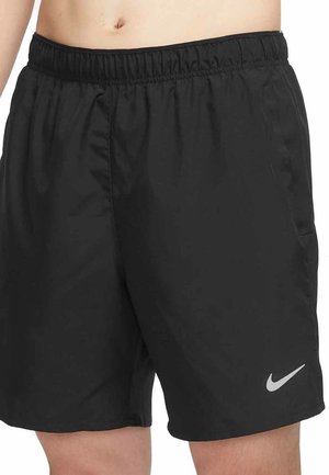 Black athletic shorts made of lightweight fabric with an elastic waistband, side pockets, and a reflective Nike logo on the lower left side.