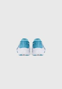Blue and white athletic shoes with a textured knit upper, rounded heel, and distinct tread pattern on the sole for grip.