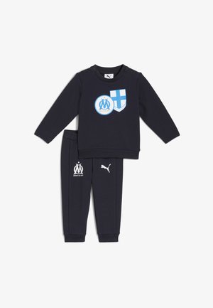 Sort sæt til småbørn med sweatshirt og bukser med blå og hvide Marseille fodboldklub- og Puma-logoer, trykknapper på sweatshirtens skulder.