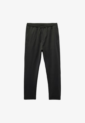 Schwarze Sweatpants aus weichem, dehnbarem Material, mit einem elastischen Bund und Kordelzug, zwei Seitentaschen und schmal zulaufenden Beinen.