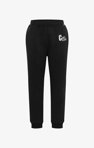 Sorte sweatpants lavet af bomuld, med en elastisk talje, tapered ben og et logo i hvidt på forsiden.