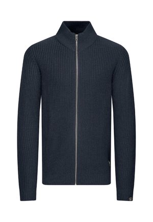 Navy zip-up knit sweater with a high collar, ribbed texture, and long sleeves. Features a silver zip and logo detail near the hem.