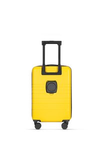 Yellow hard-shell suitcase with black accents and a textured surface. Features a retractable handle and four wheels for mobility.